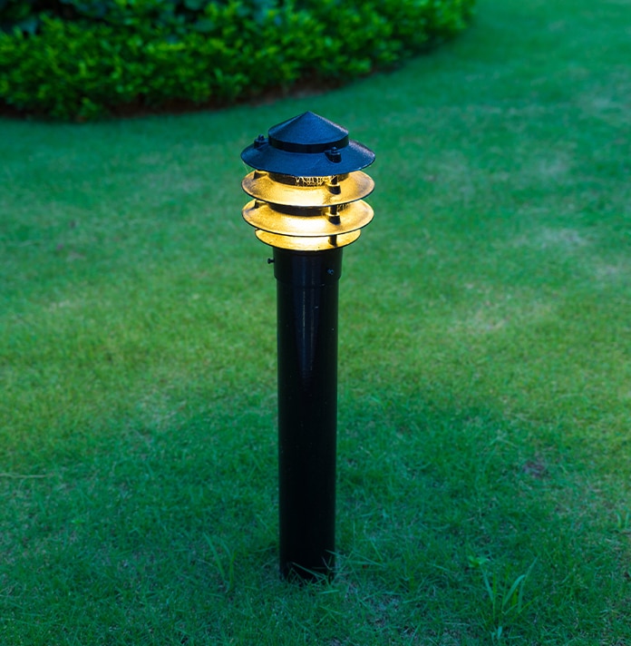 a blue fire hydrant sitting in the middle of a field